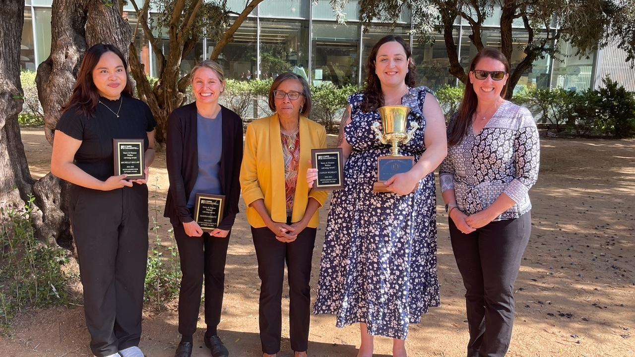 Marissa Baskett is pictured second to the left next to Dean Helene Dillard and the other award receipients